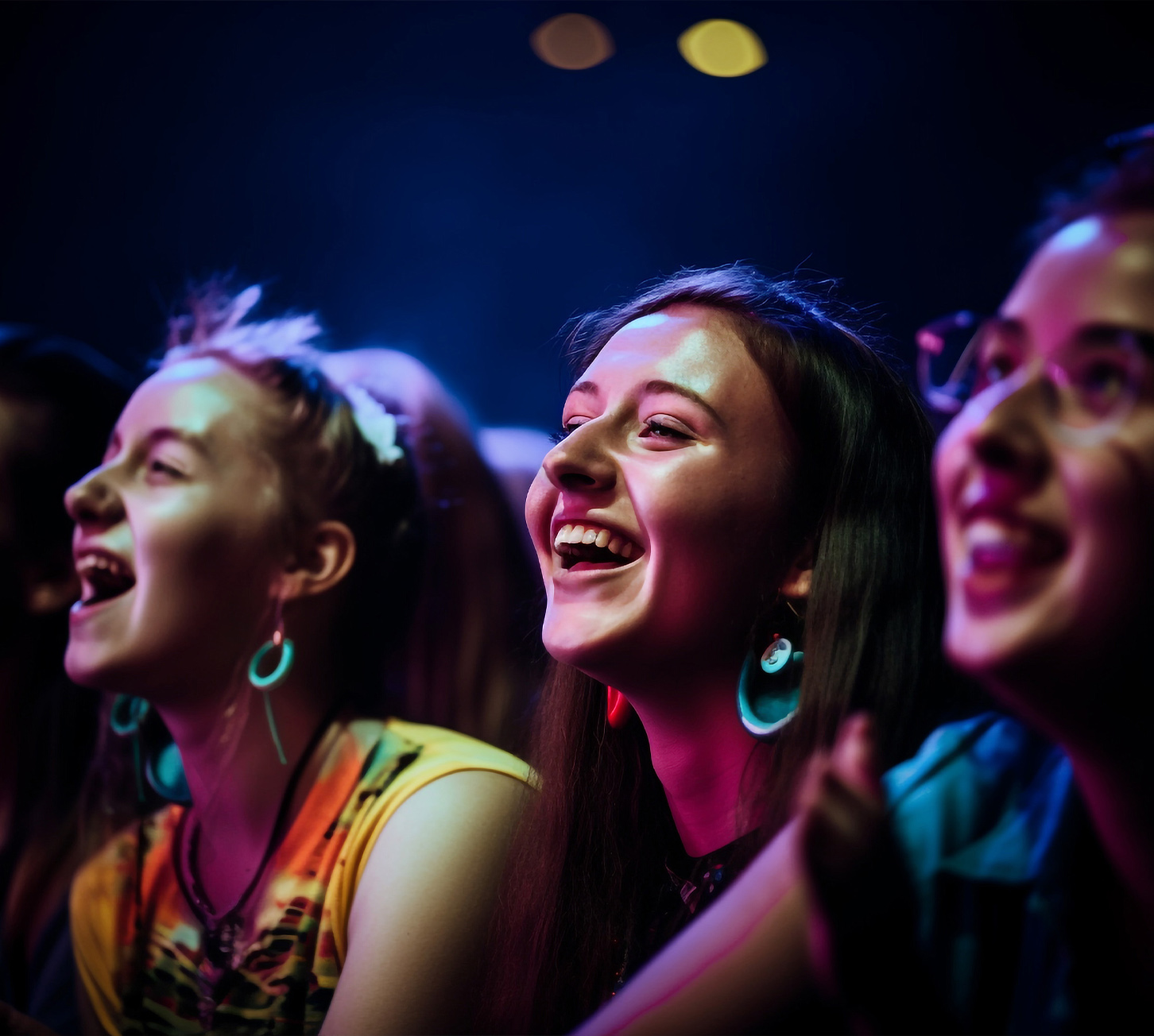 People laughing during a comedy show