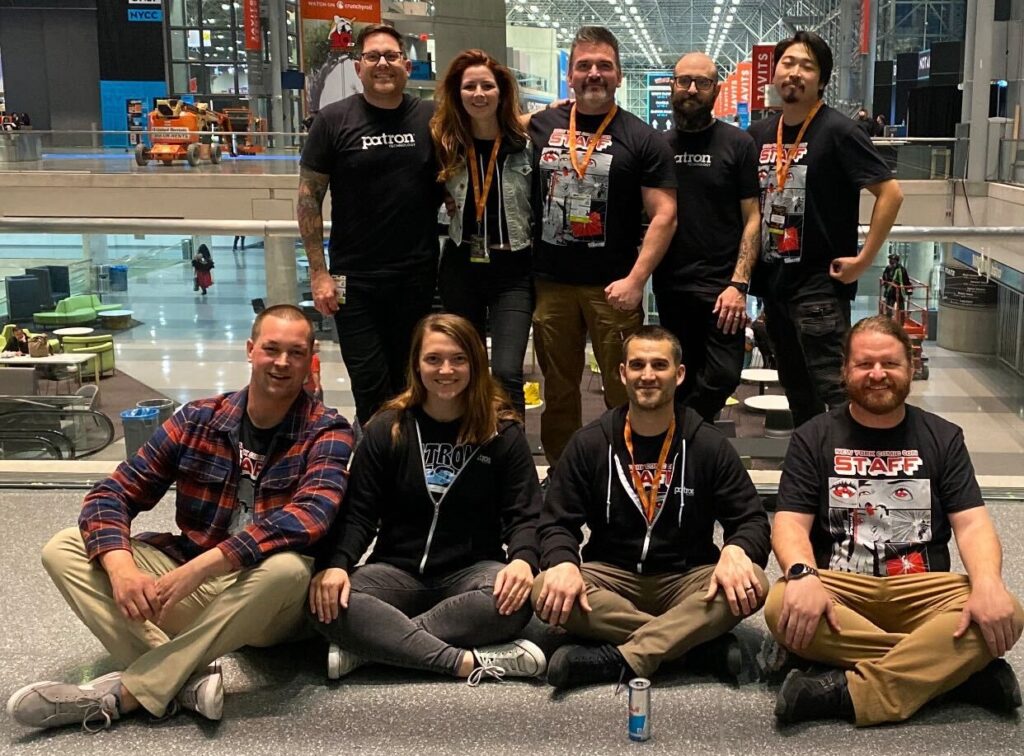 event operations team wearing lanyards and posing for photo at New York Comic Con
