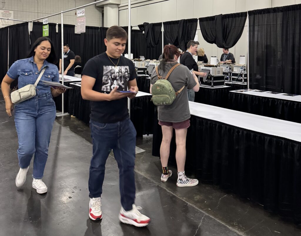 Attendees picking up their pictures after Leap's celebrity photo ops solution